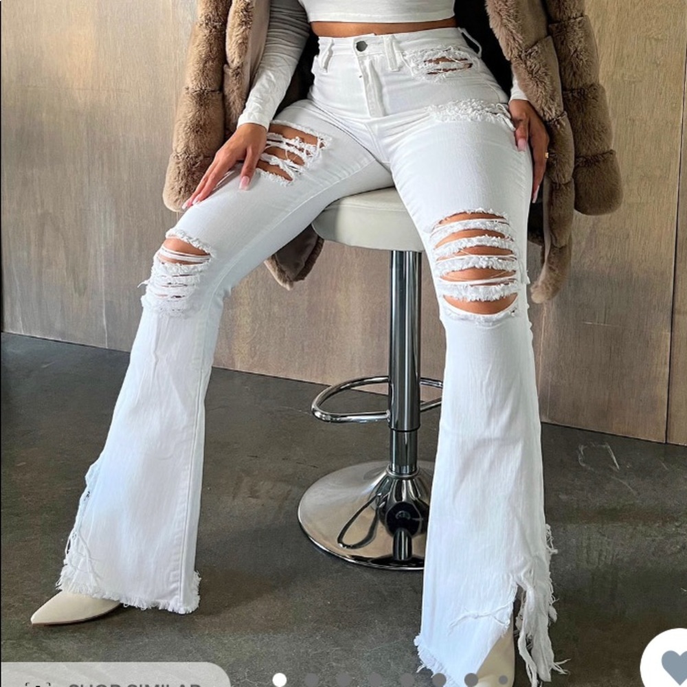 White flare leg distressed jeans